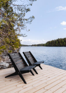 Lake front log villa pier Finland Honkarakenne photography interiors