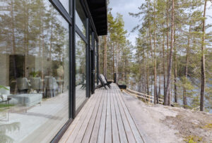 Lake front log villa terrace Finland Honkarakenne photography interiors